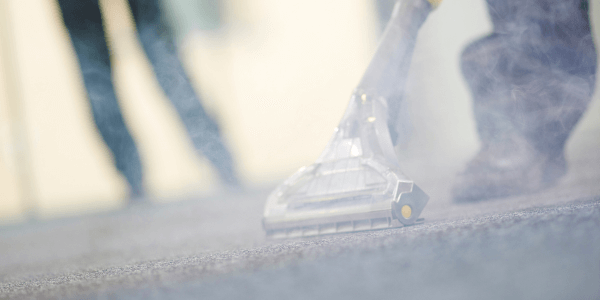 two individuals doing industrial carpet cleaning